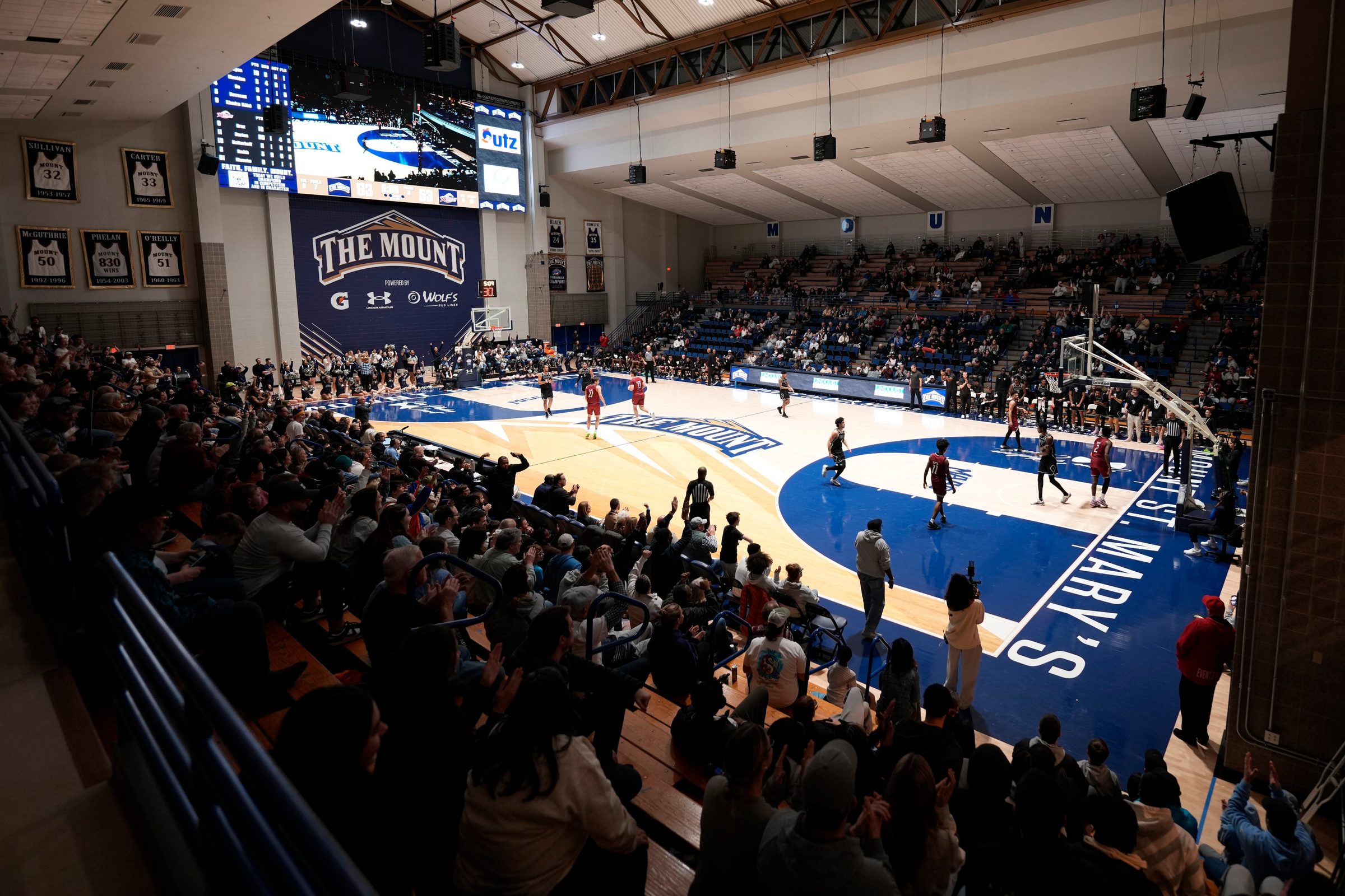 Fans cheering at a Mount St. Mary's basketball game